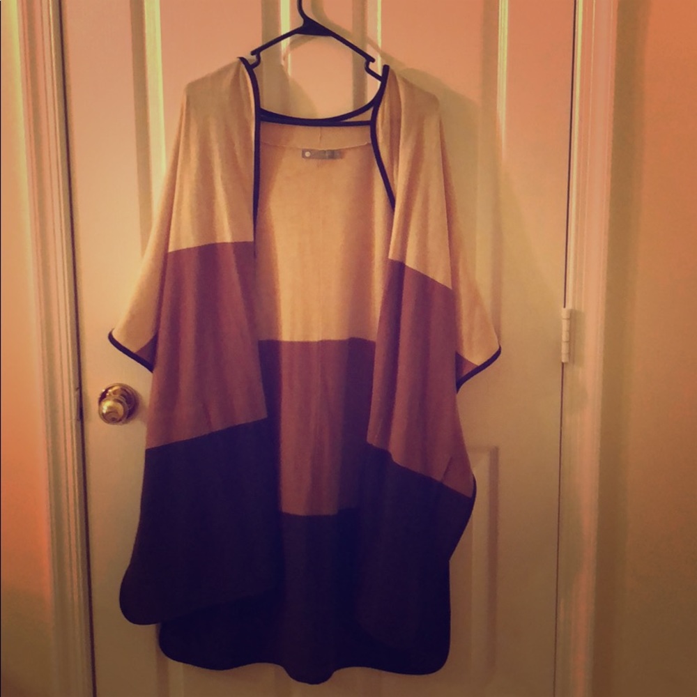 In cashmere poncho sweater